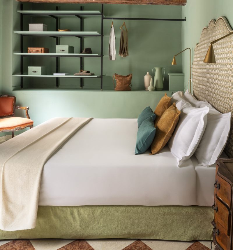 Sage green boutique bedroom with open shelving and modern decor - Hotel Riva, BZAR hotels in Venice